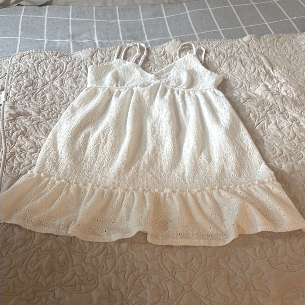 White Camisole with Spaghetti Straps and Ruffled Hem